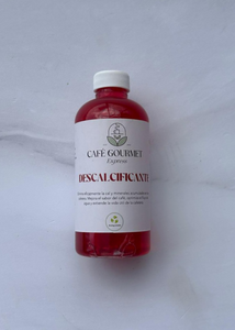Botella con liquido descalcificante color rojo de Cafe Ge